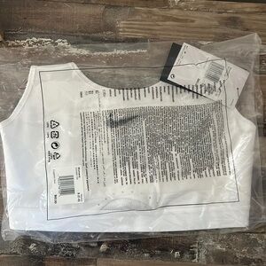 Brand new still in unopened bag! Nike women’s white sports bra